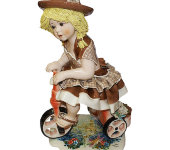 Статуэтка "Кукла на велосипеде в св. коричневом платье", Zampiva