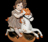Фарфоровая кукла "Девочка, сидящая на лошадке-качалке", Sibania
